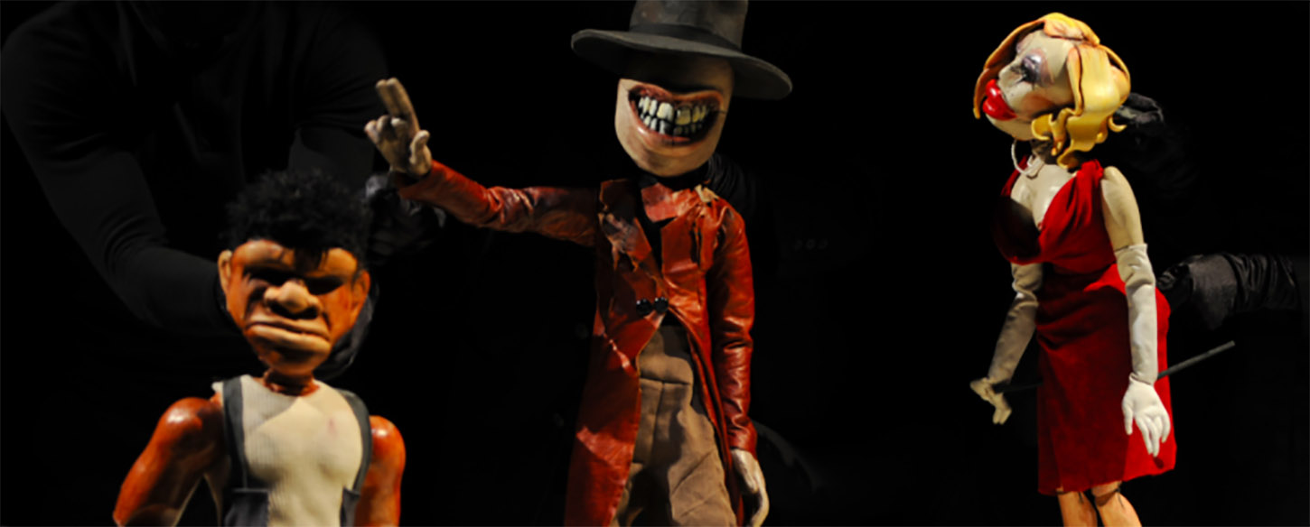 three puppets that resemble a woman, and two men