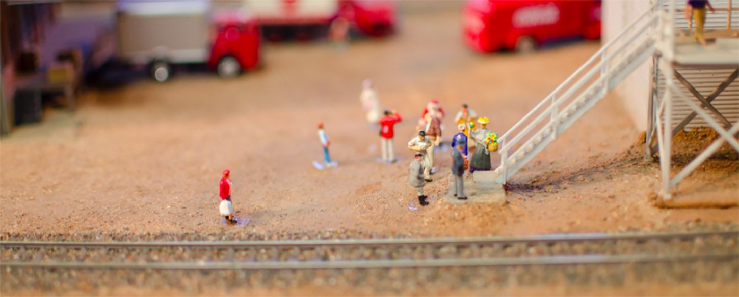 miniature figures on a toy train set